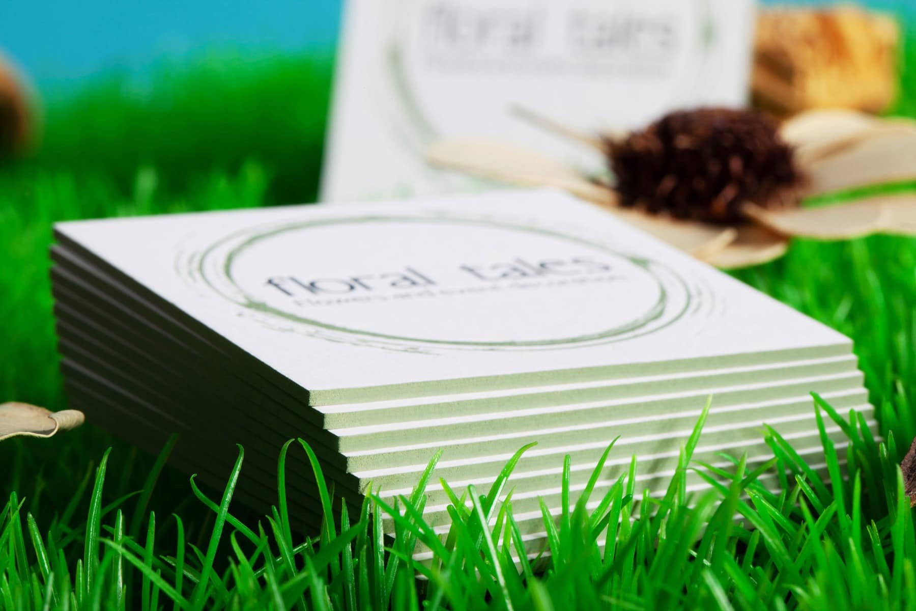 Black Favini Sumo business card with a restrained floral finish