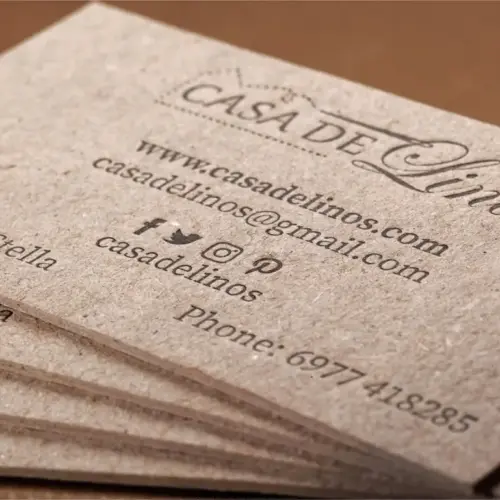 Close view of two-sided black letterpress on Casa de Linos recycled paperboard cards