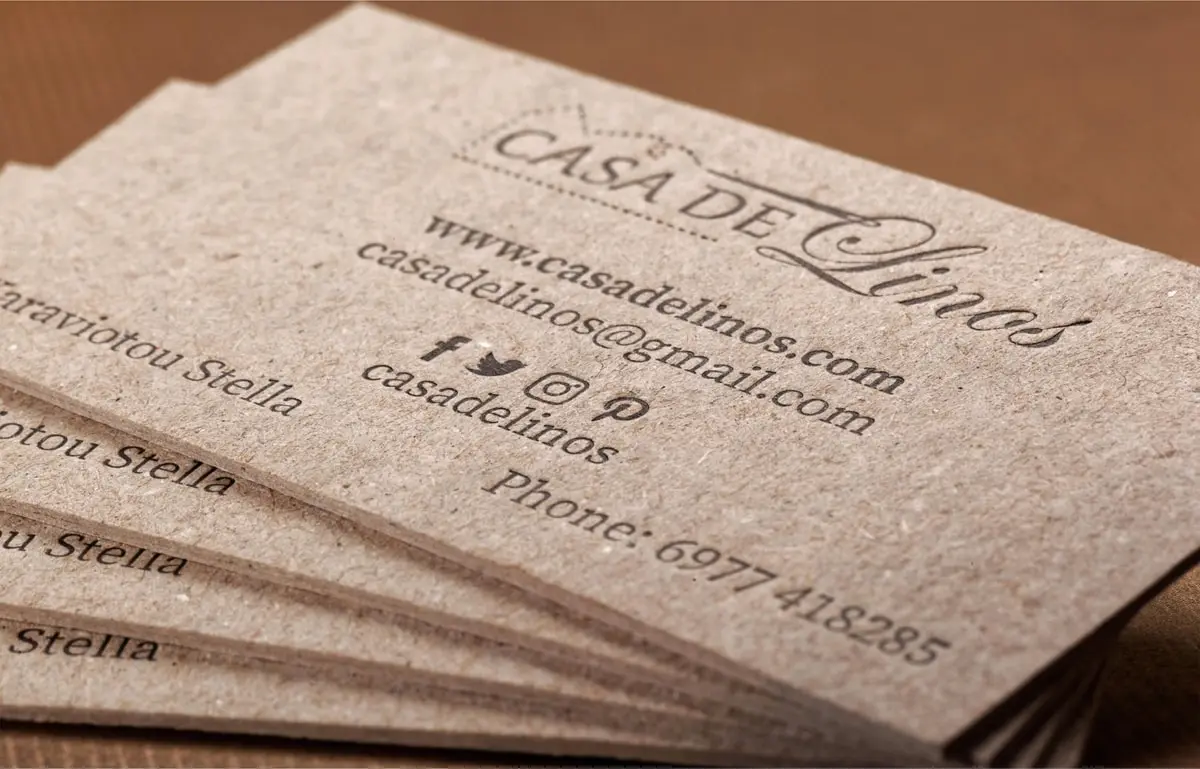 Close view of two-sided black letterpress on Casa de Linos recycled paperboard cards