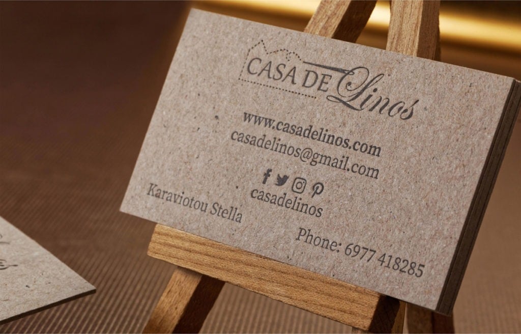 Casa de Linos card showing the fibrous Grey Grey surface and black letterpress