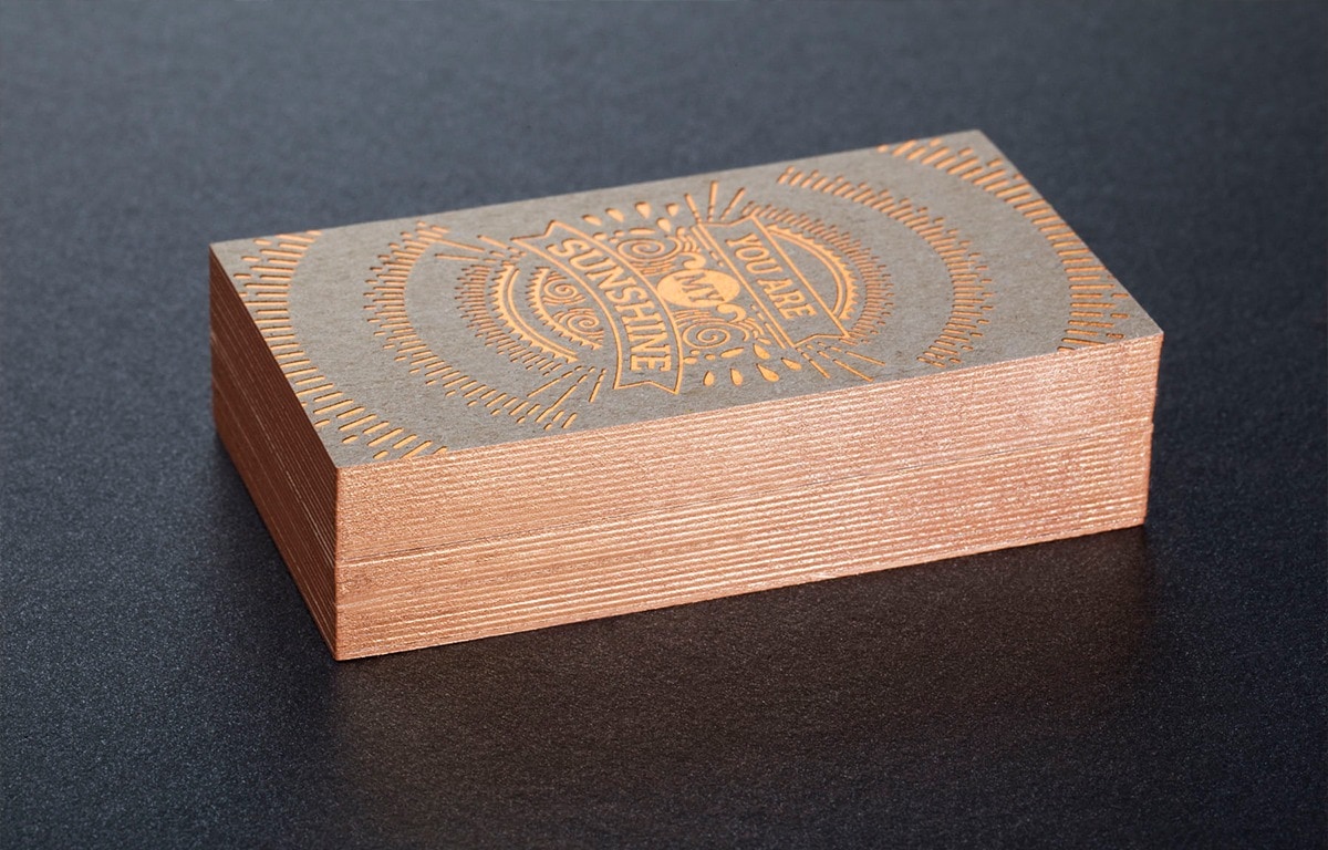 Recycled paperboard cards with brightly painted edges