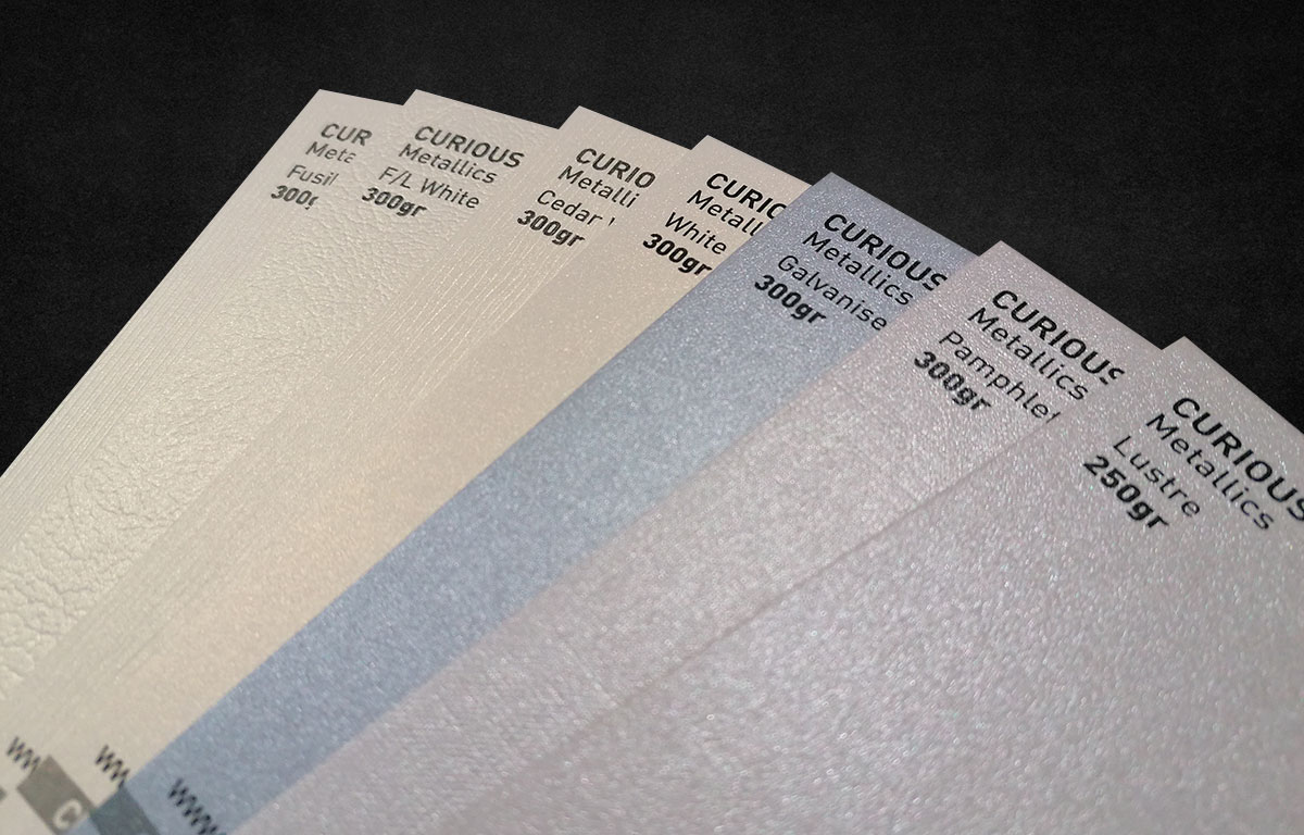 Curious Metallics paper samples viewed under directional light