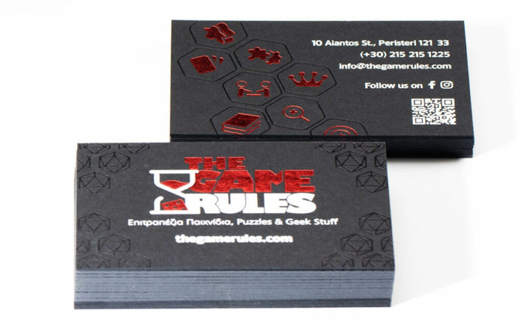 Close view of red and black foil detail on the Game Rules card
