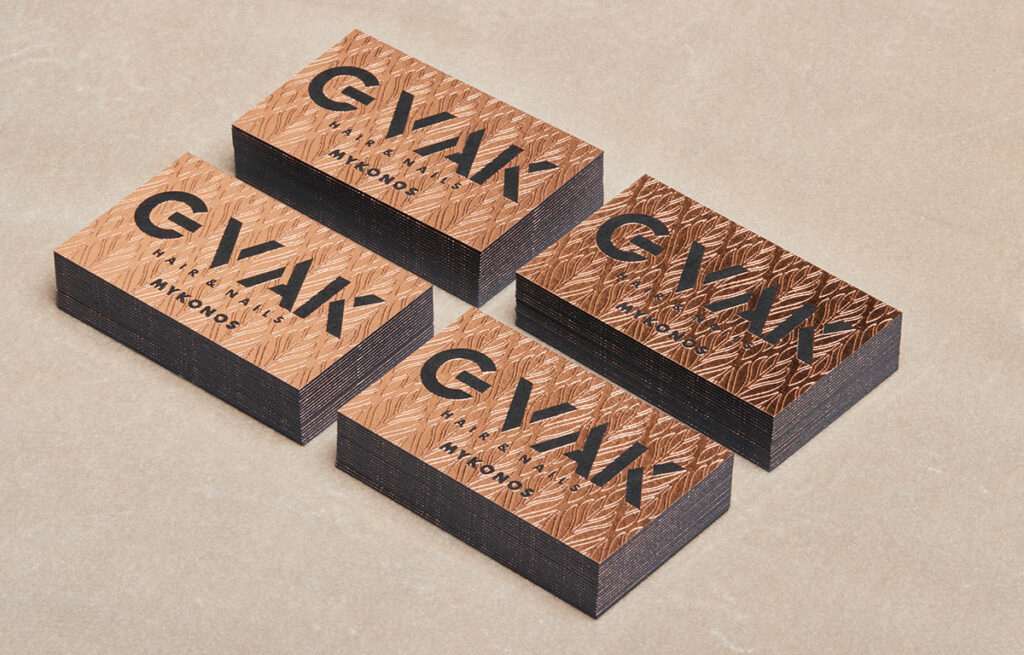 Stacks of GVAK cards showing rose-gold foil and 1 mm black board