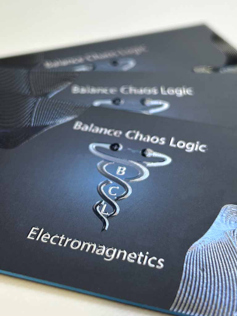 3D UV printing on a dark business card with raised clear lines and a blue painted edge