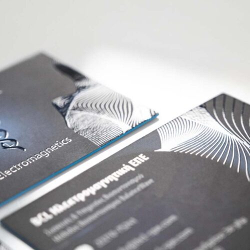 Luxury business card with raised clear 3D UV over a blue printed field