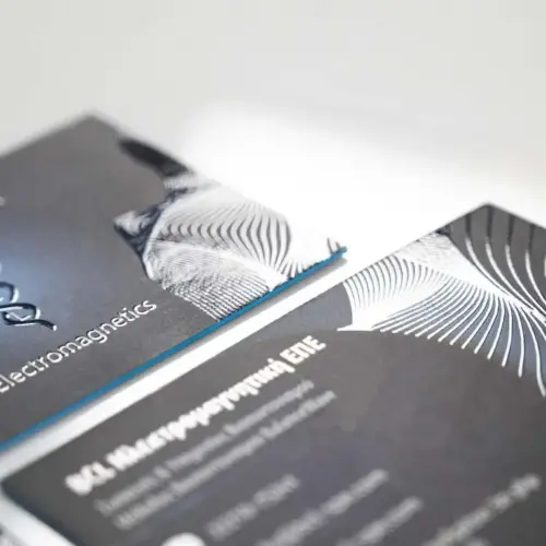 BCL Electromagnetics business card with raised clear UV over a blue printed field