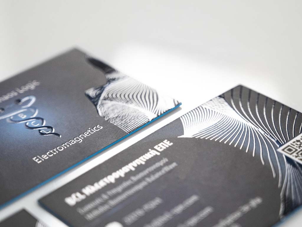 BCL Electromagnetics business card with raised clear UV over a blue printed field