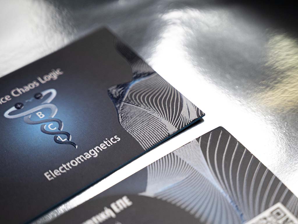 Raking-light detail of the raised 3D UV pattern on the BCL card