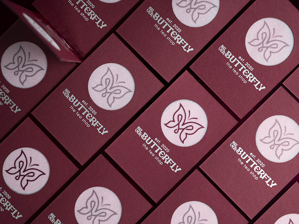 Butterfly Triplex sample cards arranged to show the repeated laser-cut window