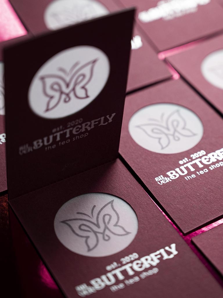 Butterfly card opened to reveal the printed translucent middle layer between the outer papers