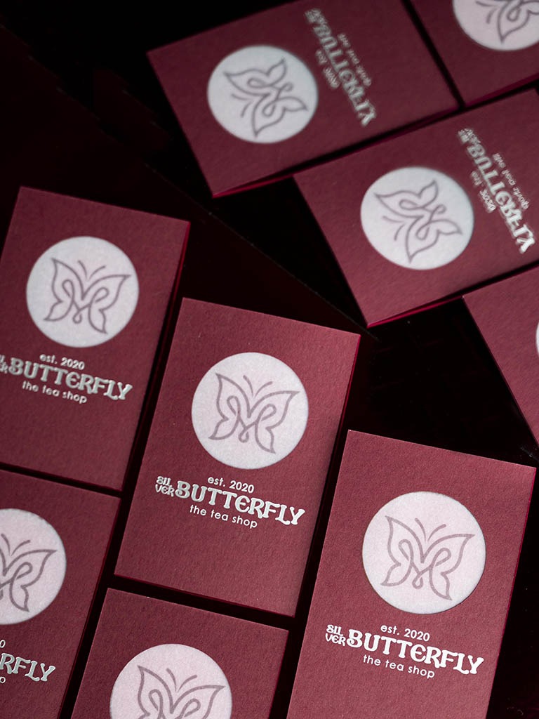 Vertical view of Butterfly cards showing matt silver foil and translucent centre artwork