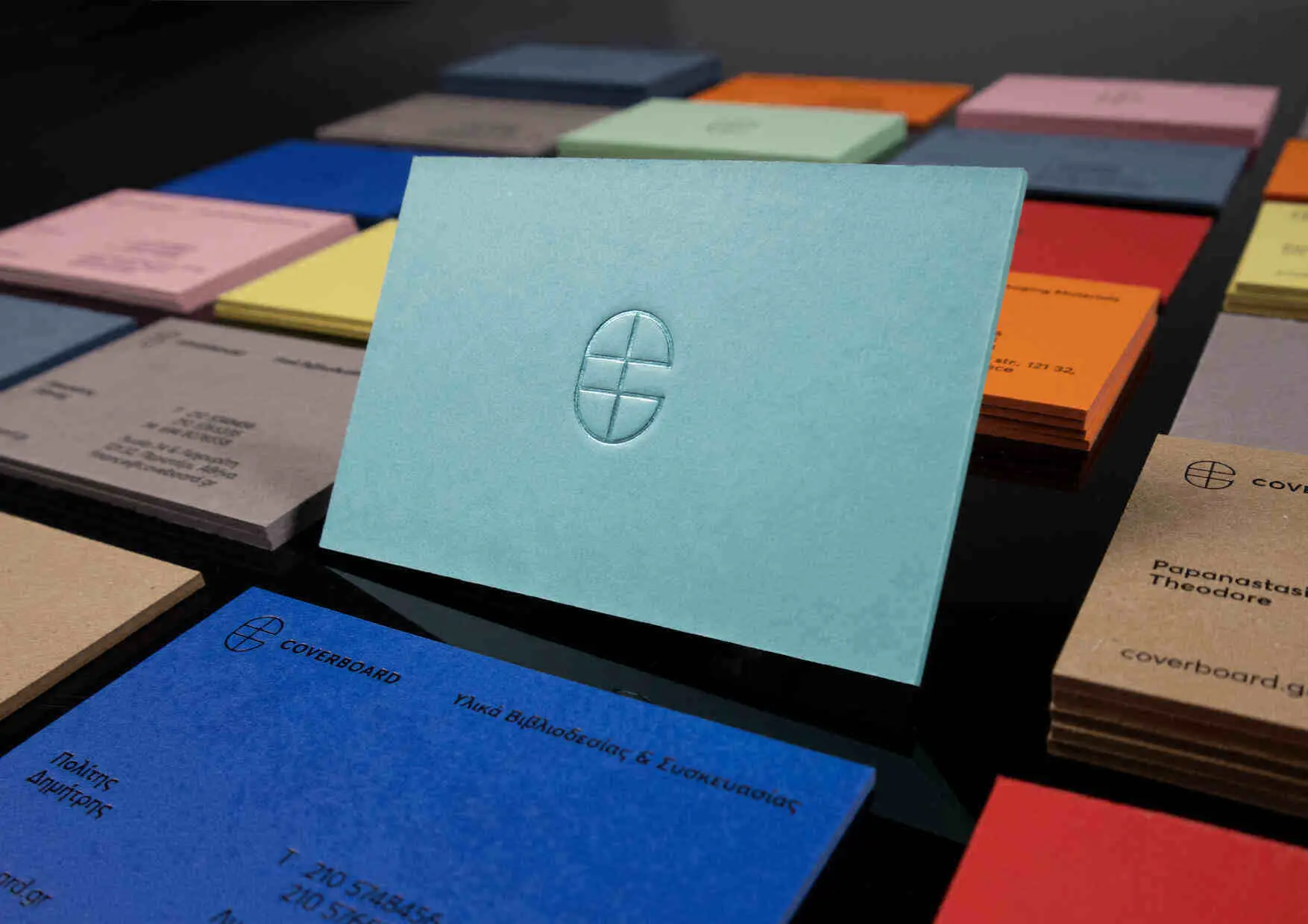 Collection of ultra-thick coloured ESKA board business cards made for Coverboard