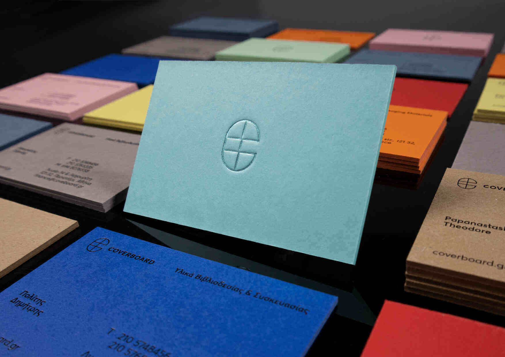 Collection of ultra-thick coloured ESKA board business cards made for Coverboard