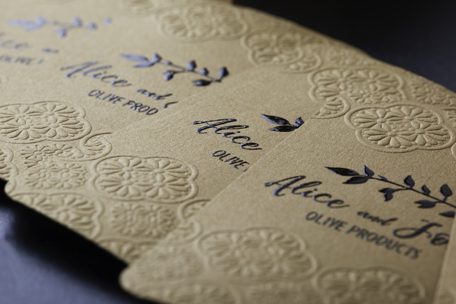 Close view of thermography and embossing on Curious Metallics Olive