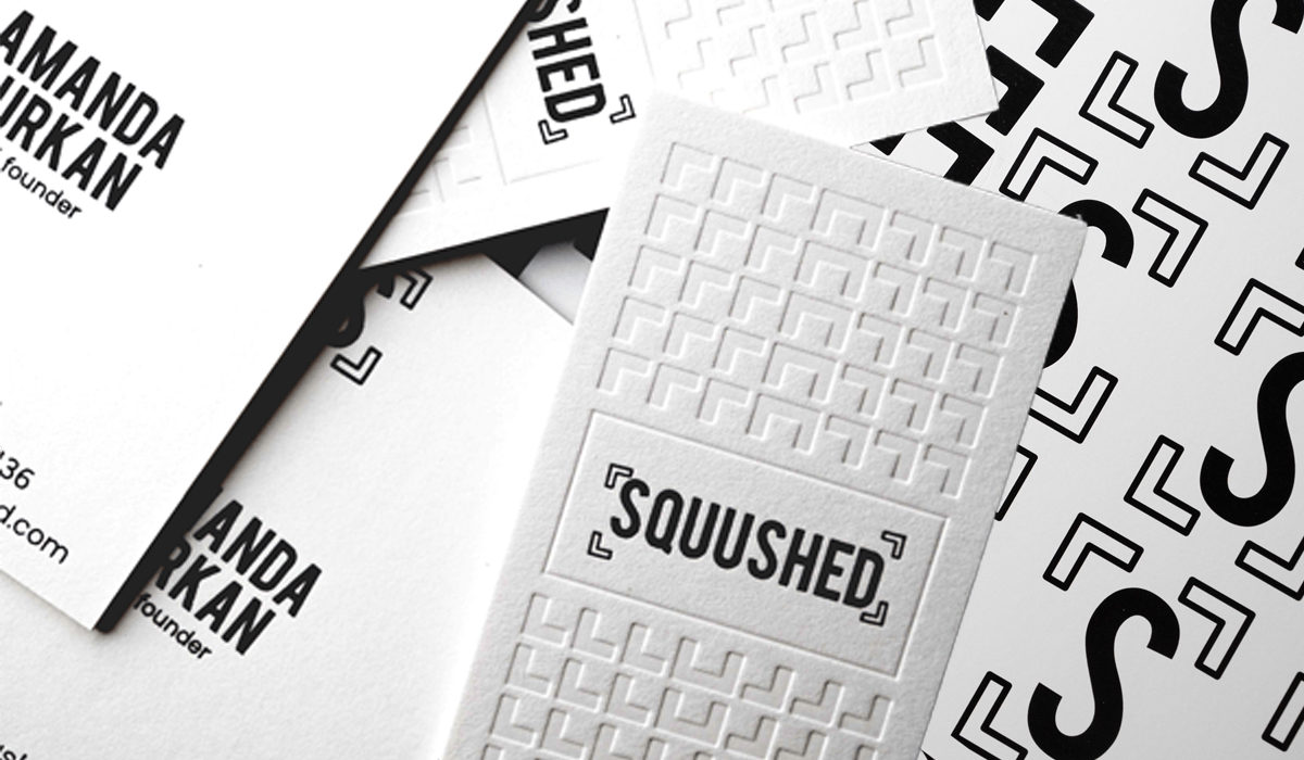 White Favini Sumo business cards with black foil and blind letterpress