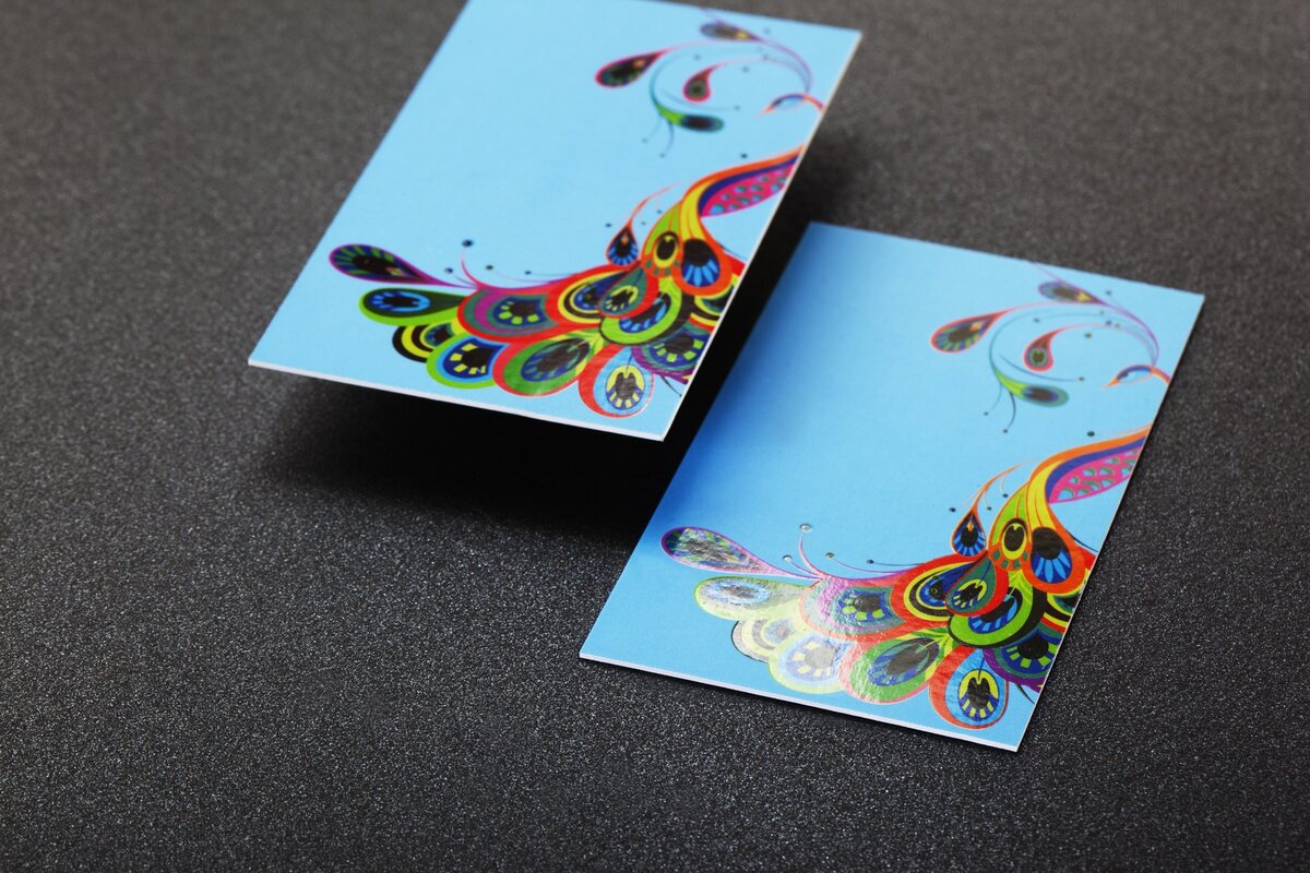 Colourful cards using a matt laminated surface beneath selective gloss details