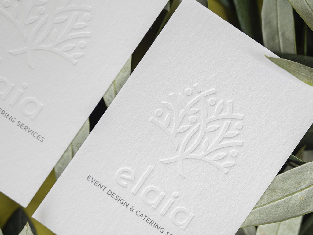 Blind letterpress tree pressed into an uncoated white business card