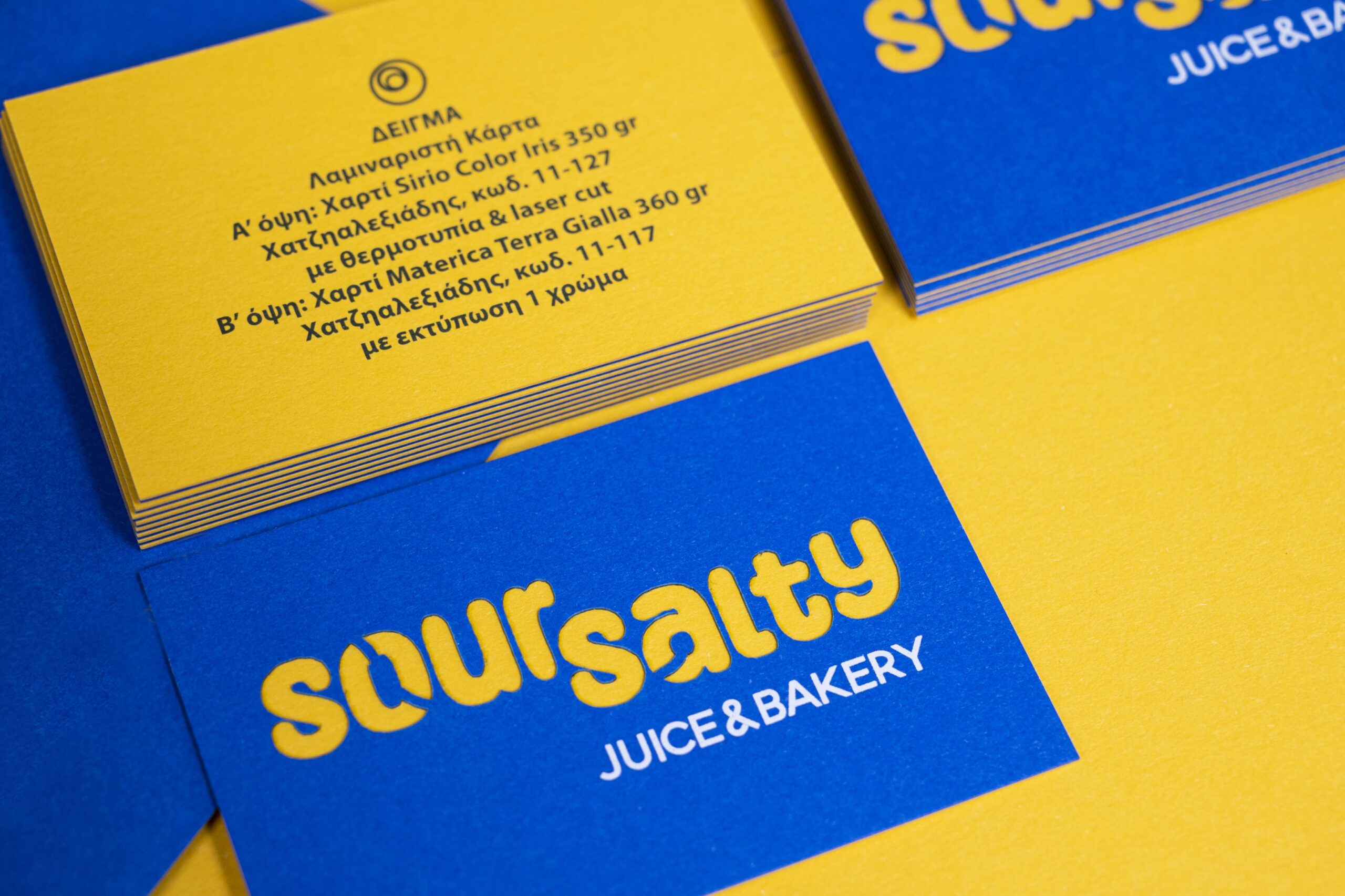Materica Terra Gialla cards paired with blue paper, laser cutting and white hot foil