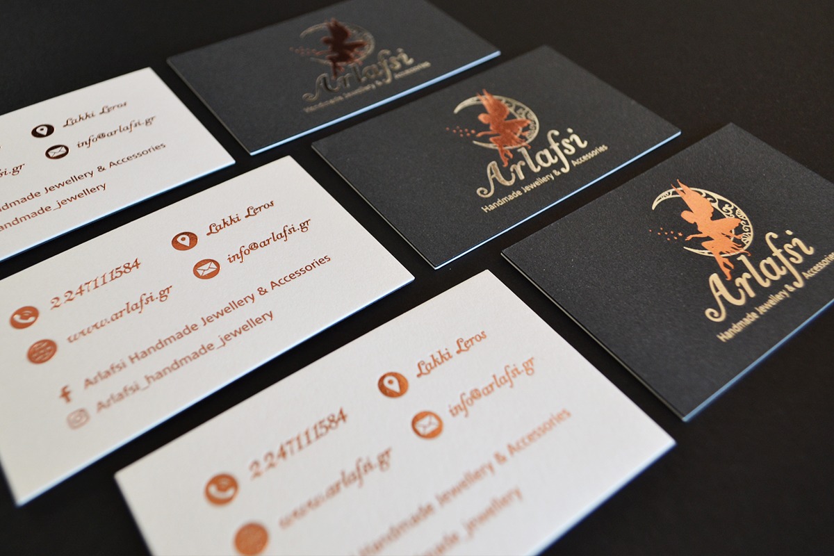Materica cards using dark and light papers with several hot-foil colours