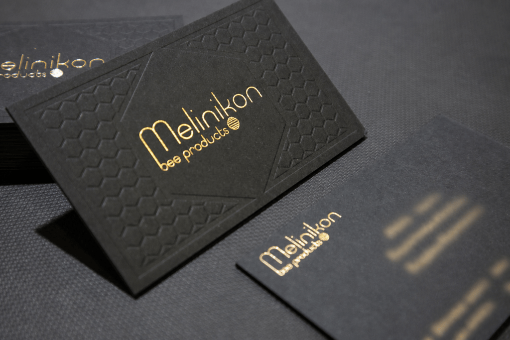 Melinikon card with gold foil and blind impression; personal contact details obscured