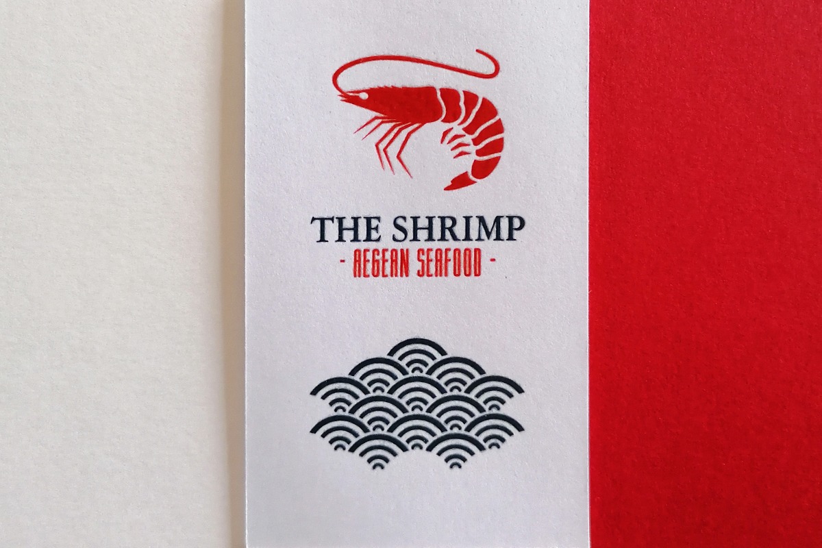 White and red business card combining Pantone colour and thermography